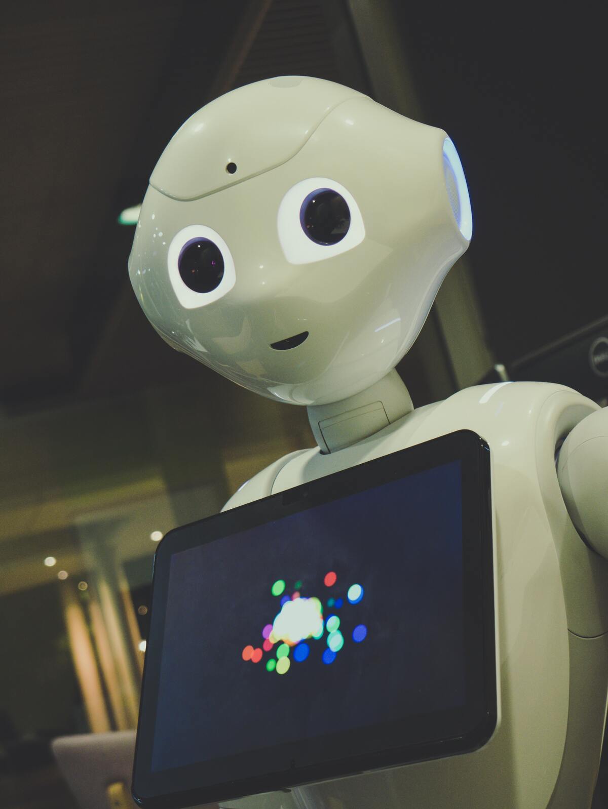 robot holding a screen